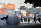 Policemen fire tear gas shells to disperse supporters of the Pakistan Tehreek-e-Insaf (PTI) party during a protest demanding the release of former prime minister Imran Khan [photo: AFP]