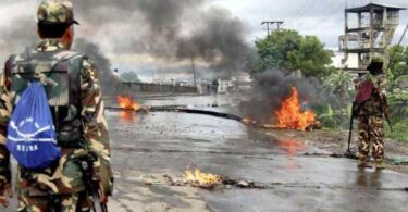 Army personnel guard the streets after violent protests in Minuthong, Imphal, on Tuesday. (Express Photo)