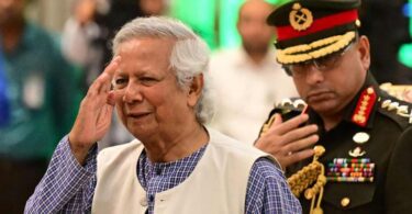 Muhammad Yunus with General Waker-uz-Zaman | AFP