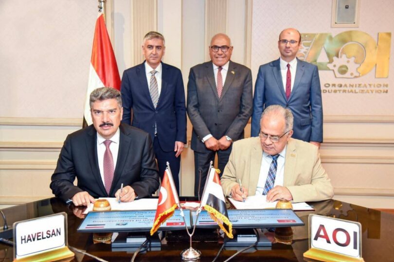 Representatives from Turkey’s defense firm HAVELSAN and Egypt’s Arab Organization for Industrialization sign an agreement in Cairo on August 26, 2025, to jointly produce vertical takeoff and landing drones