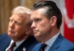 Defense Secretary Pete Hegseth and President Donald Trump listen during a Cabinet meeting at the White House, Aug. 26, 2025. | Mark Schiefelbein/AP