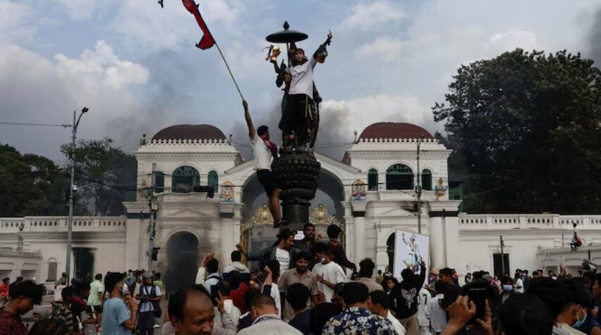 Demonstrators celebrate after storming the Singha Durbar palace