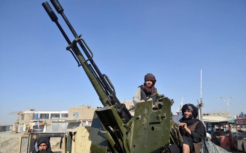Taliban fighters use an anti-aircraft gun during clashes. (AFP)