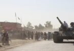 An Afghan Taliban fighter sits on a tank near the Afghanistan-Pakistan border in Spin Boldak, Kandahar Province, following exchanges of fire between Pakistani and Afghan forces in Afghanistan. Reuters